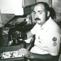 Jerry Smith, Cytologist, working at the microscope.